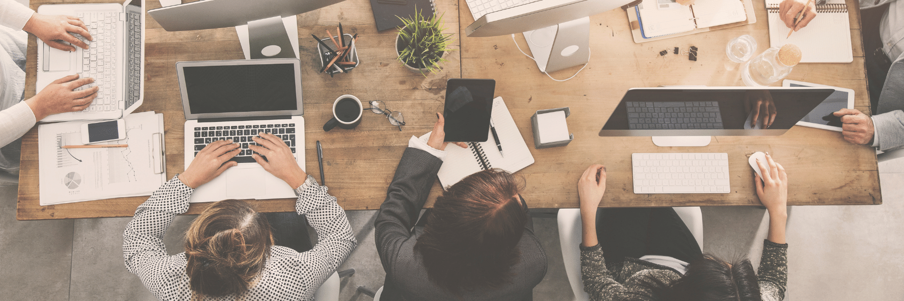 Professionals working at a desk together