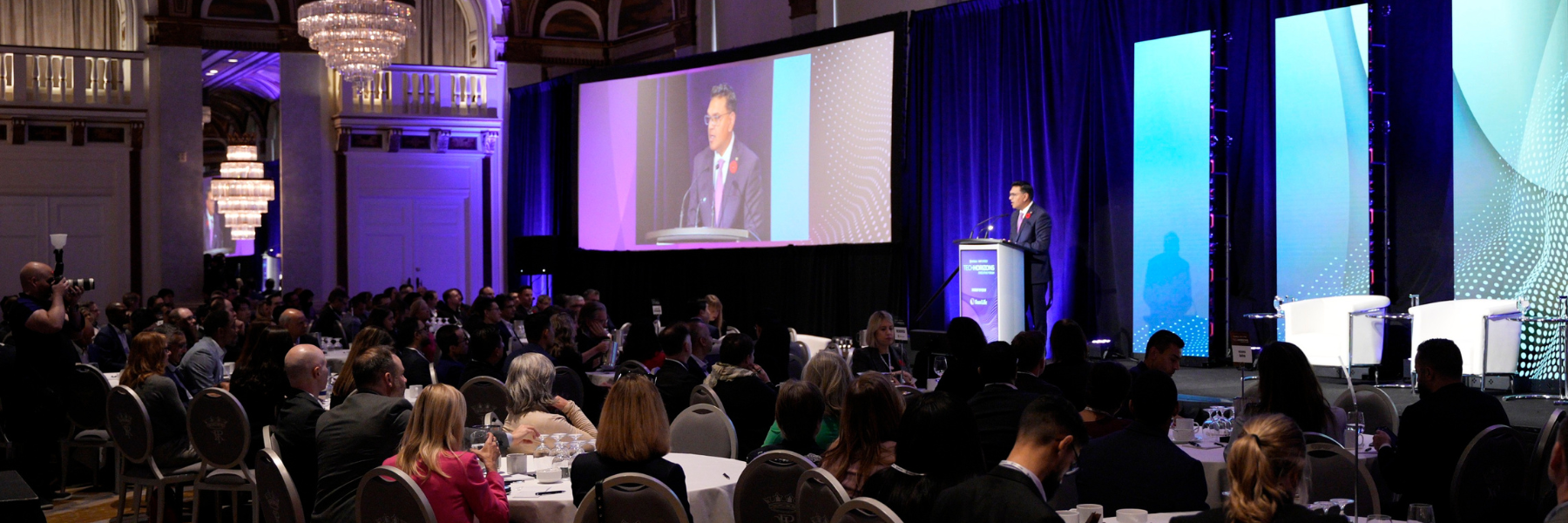 WatSPEED executive director Sanjeev Gill addresses a ballroom of 200 executive leaders