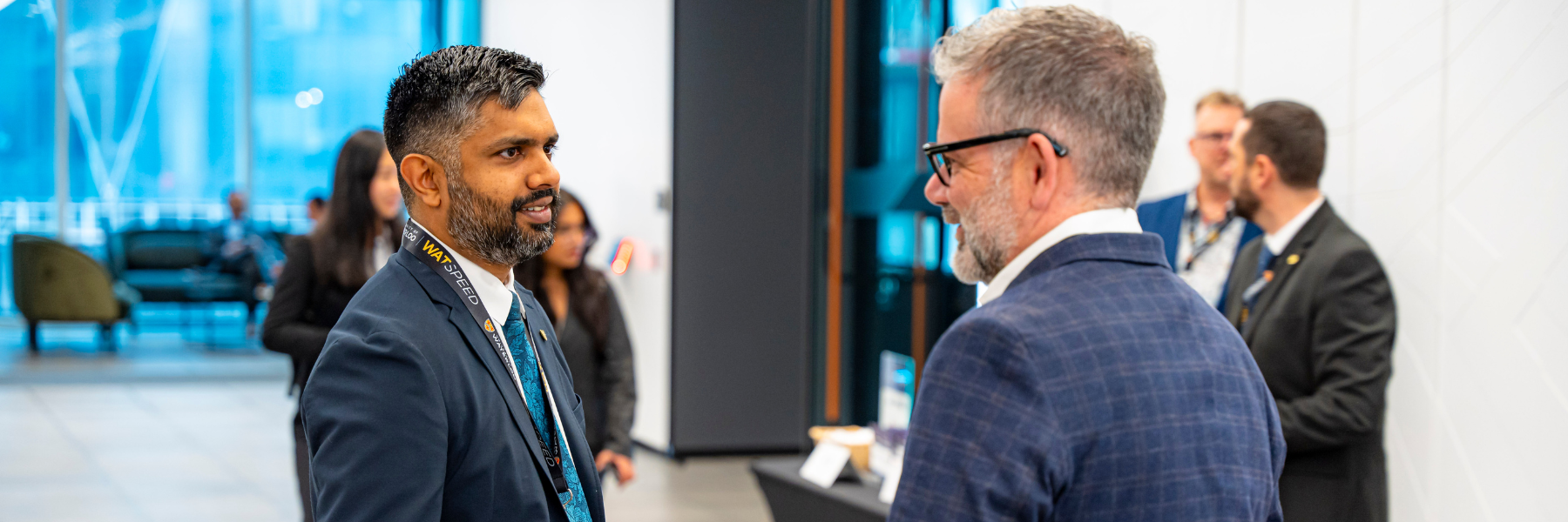 Aaron Pereira speaking to a partner