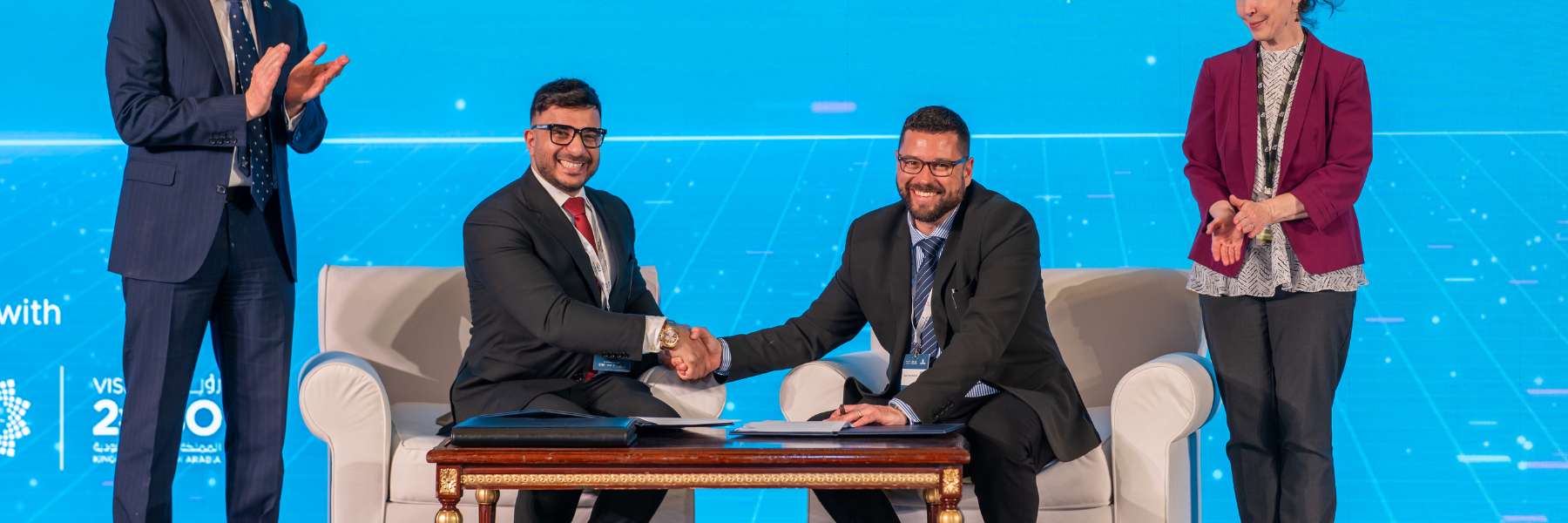 WatSPEED and PG Studios representatives signing an agreement