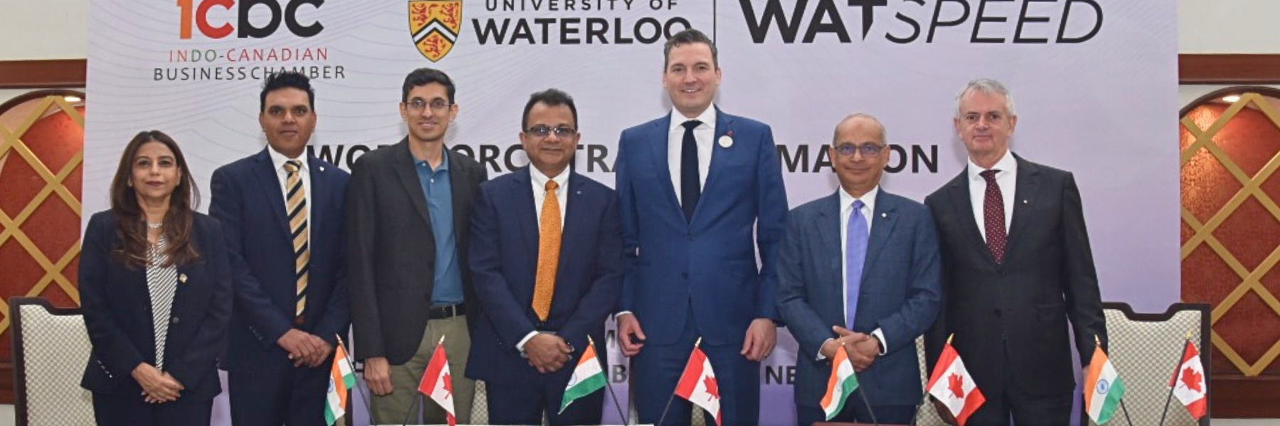 Representatives from Waterloo, upGrad and TCS pose with Evan Solomon and Peter Fedeli